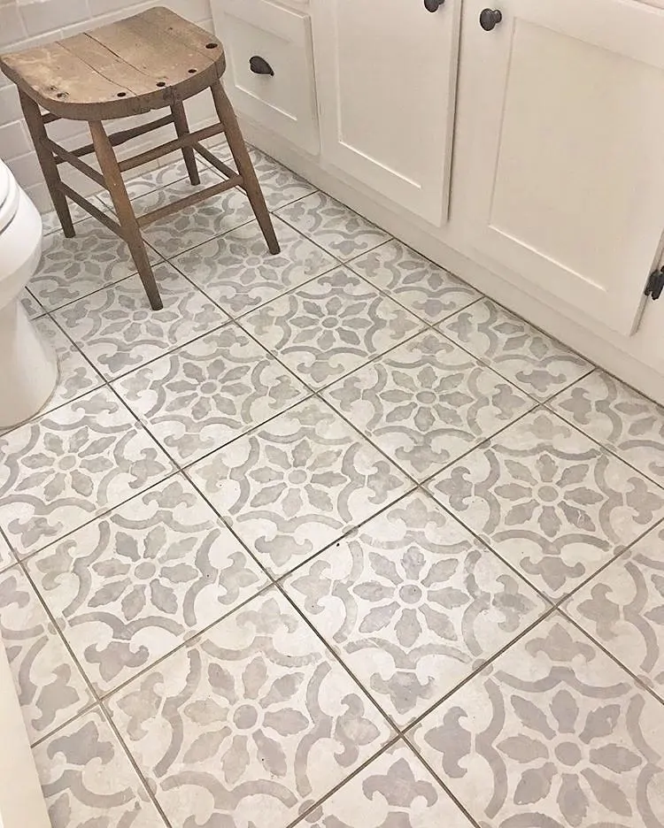 Cement-pattern bathroom floor tile in a Center Point farmhouse